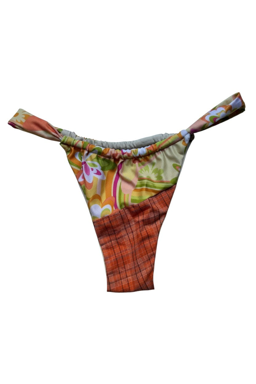Thoughts Reworked patchwork bikini bottoms with orange plaid and floral print. Adjustable ties.