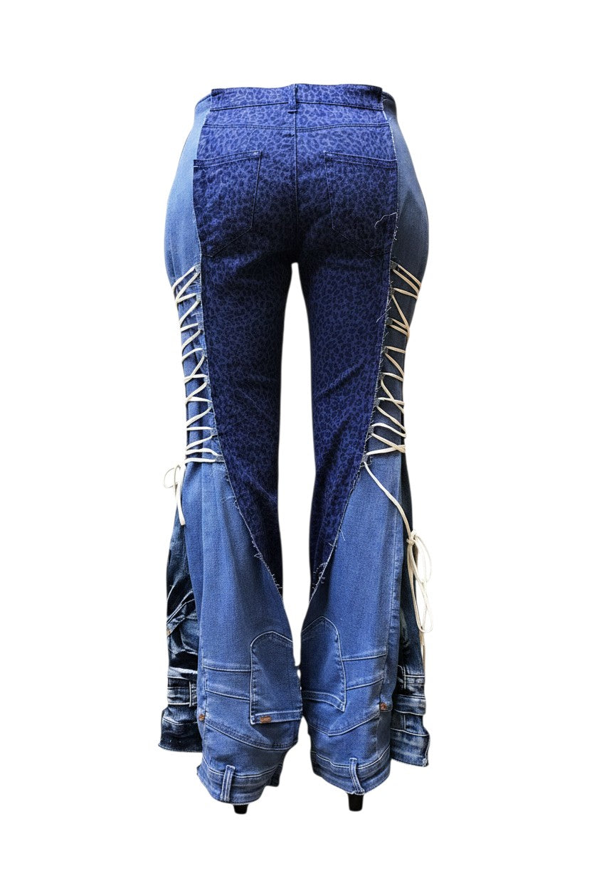 Thoughts Reworked blue denim jeans with leopard print panels and adjustable side lacing.