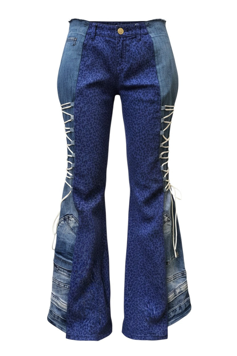 Thoughts Reworked blue patchwork denim jeans with leopard print panels and adjustable side straps.