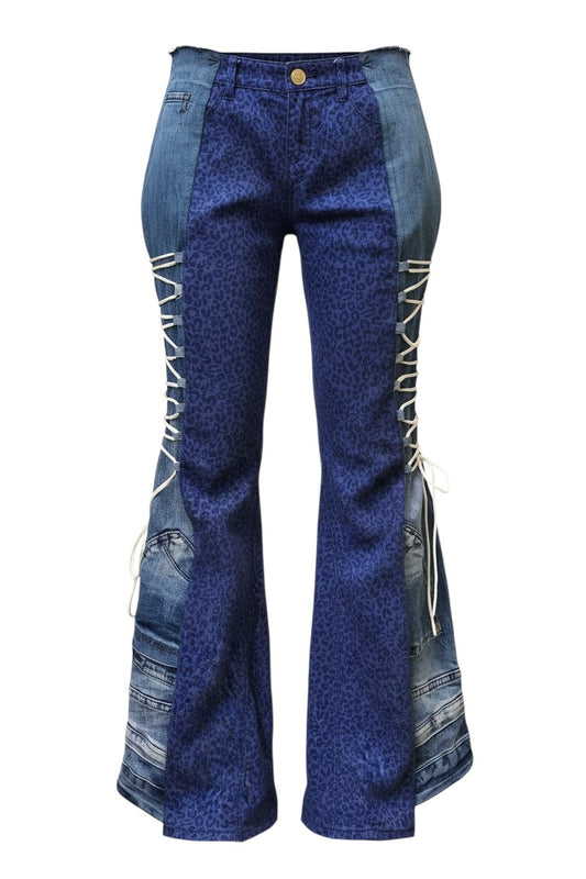 Thoughts Reworked blue patchwork denim jeans with leopard print panels and adjustable side straps.