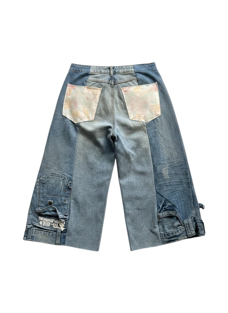Thoughts Reworked light wash denim jorts with patchwork and cargo pockets, raw hem.