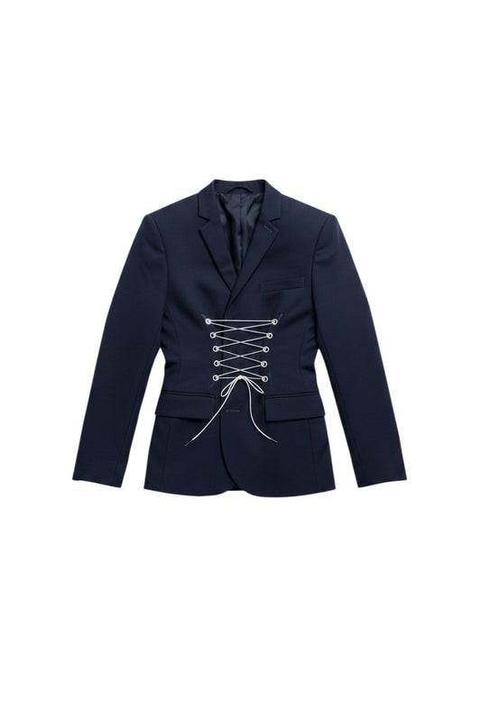 Thoughts Reworked navy blue reworked blazer with corset lacing detail, worn by a model with light wash denim jeans.