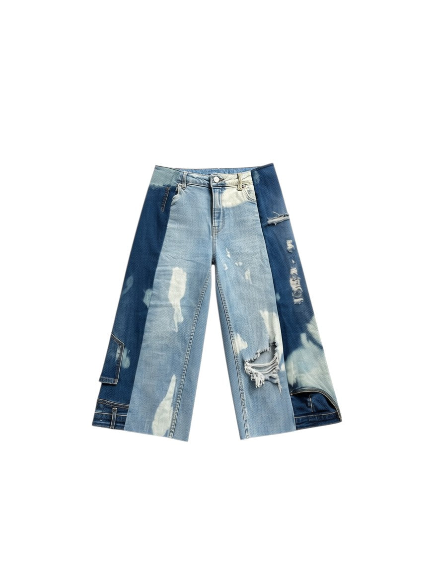 Thoughts Reworked patchwork bleach denim jorts with distressed details and raw hem.