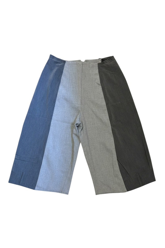 Thoughts Reworked patchwork wide leg cropped trousers in grey and blue, featuring contrasting fabric panels and a relaxed fit.