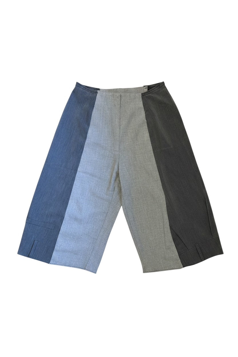 Thoughts Reworked patchwork wide leg cropped trousers in grey and blue, featuring contrasting fabric panels and a relaxed fit.