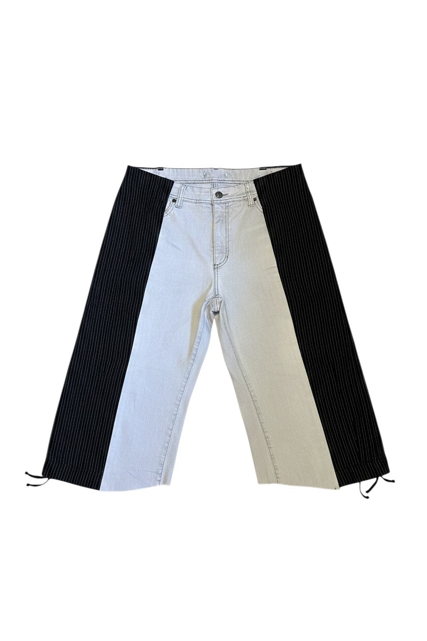 Thoughts Reworked patchwork wide leg denim shorts in light wash denim and black pinstripe fabric with raw hem.