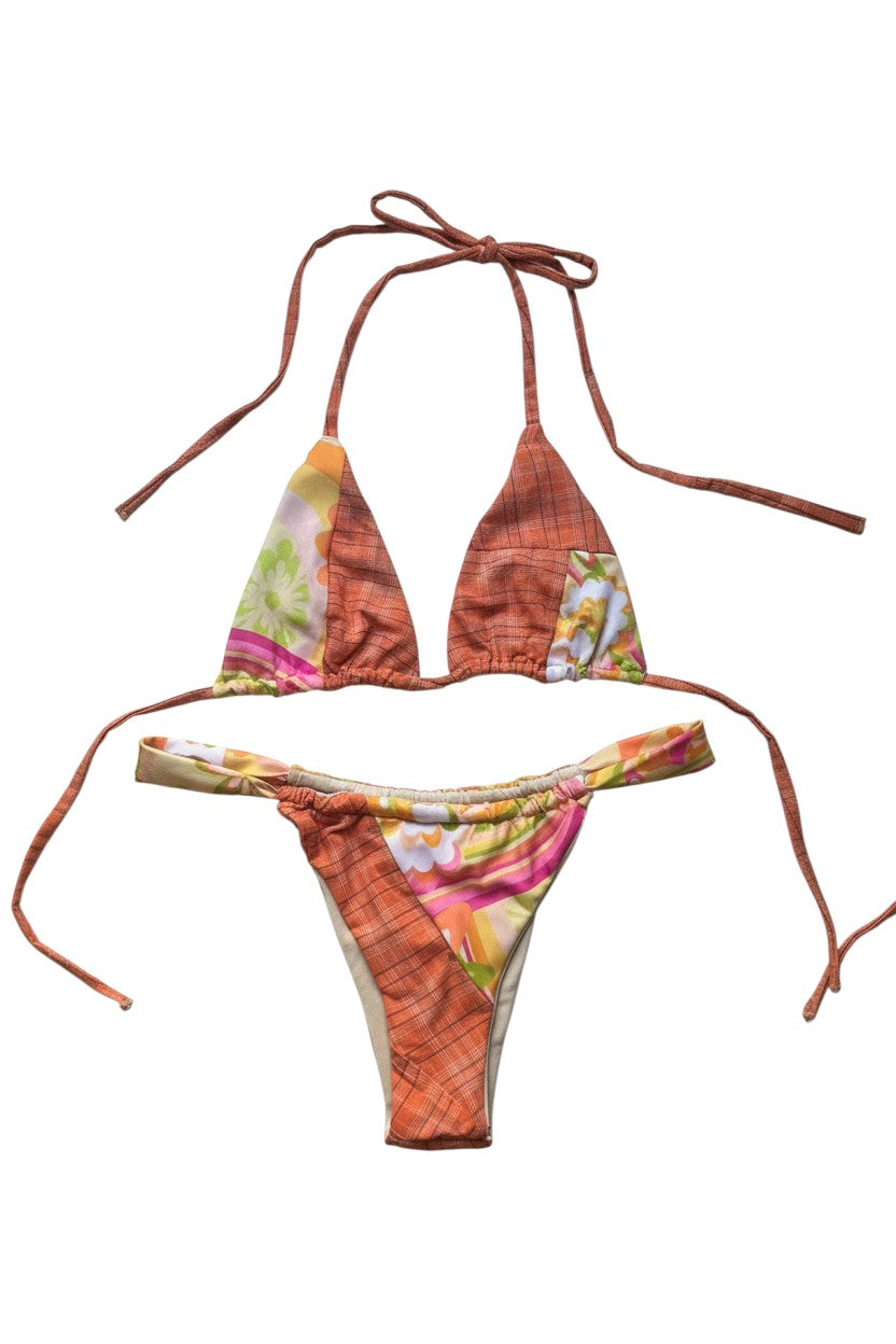 Thoughts Reworked patchwork print string bikini swimsuit set with orange plaid and floral accents. Halter top and bikini bottoms with adjustable ties.