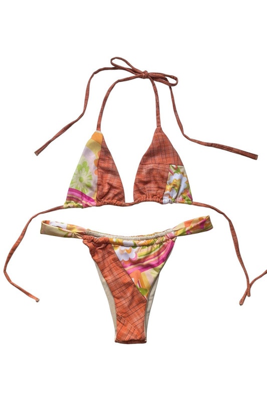 Thoughts Reworked patchwork print string bikini swimsuit set with orange plaid and floral accents. Halter top and bikini bottoms with adjustable ties.