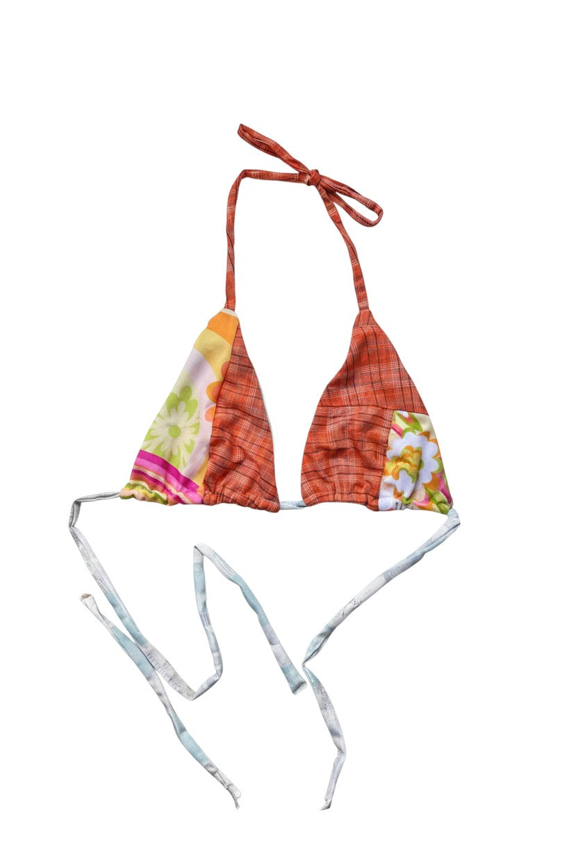 Thoughts Reworked halter bikini top with patchwork print in orange plaid, floral, and stripes. Adjustable ties.